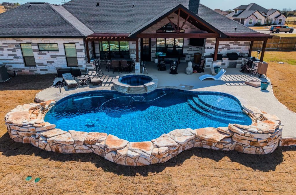 POOL-ology installer completing a fiberglass pool setup in Wells Point, TX, turning a backyard into a luxury retreat, fiberglass installation near me
