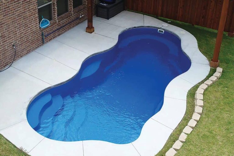 Bermuda 12 fiberglass pool, freeform curved design with white concrete surround