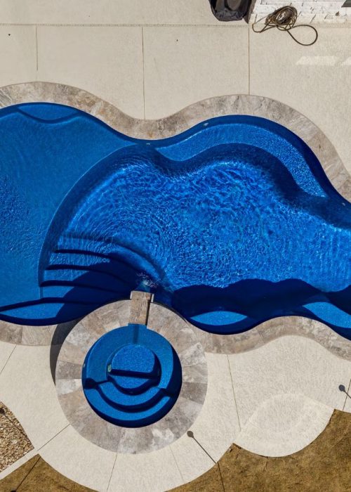 A POOL-ology professional delivering premium fiberglass pool construction in Heatherwilde, TX with elegant custom design. Fiberglass Pool Construction near me.